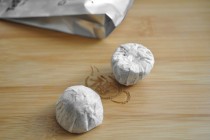 Two mini puer touchas in paper