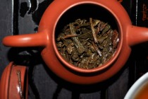 wet aged pu erh leaves in a teapot